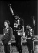 US olympic athletes, Tommie Smith and John Carlos, extend their hands in racial protest